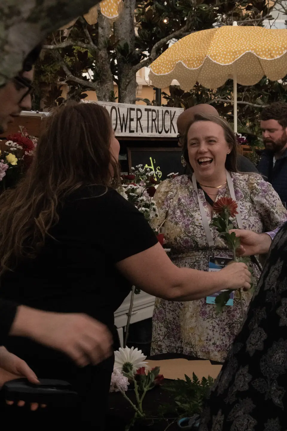 Guest enjoying the bouquet bar at a corporate reception